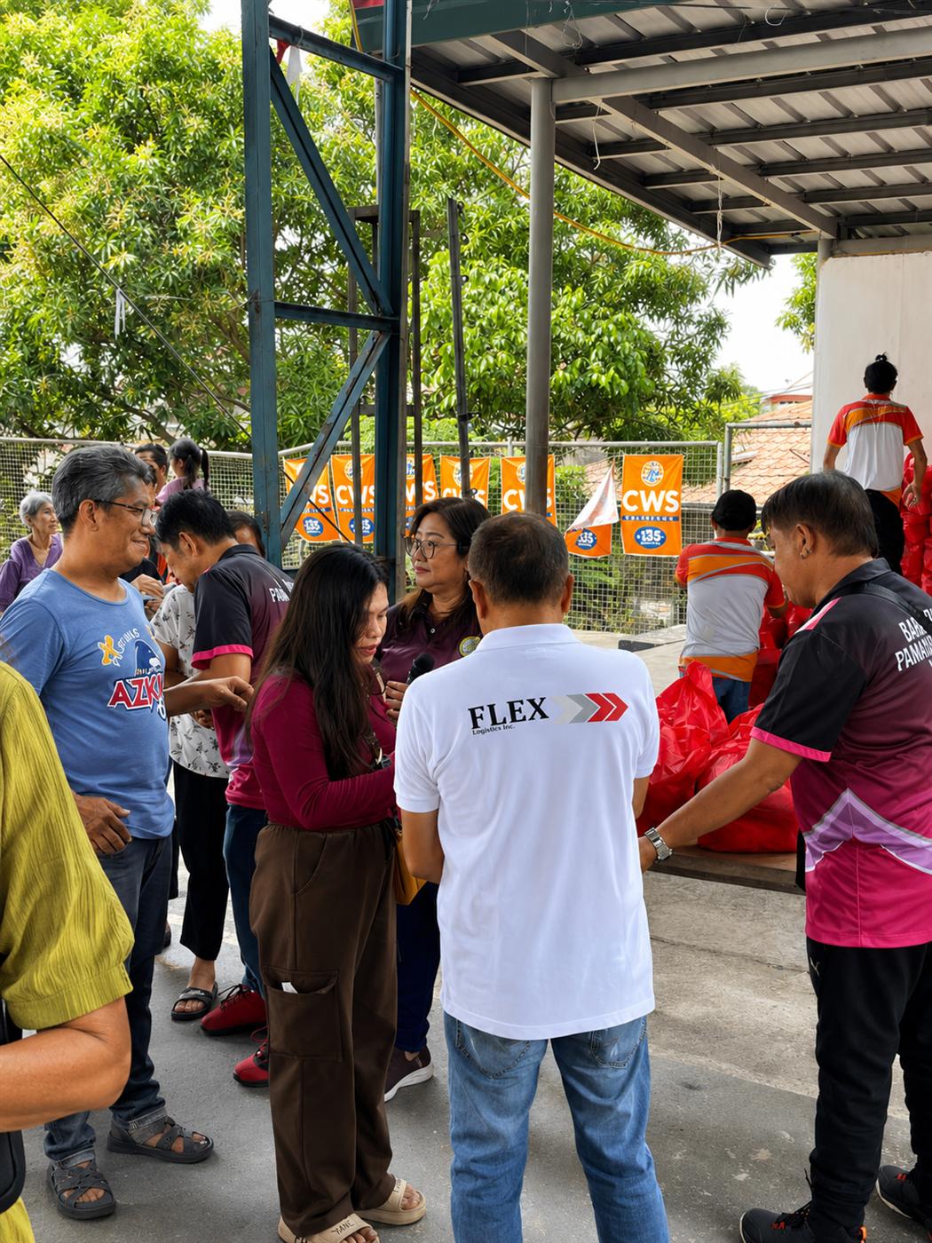 Flex team members working alongside local officials and residents