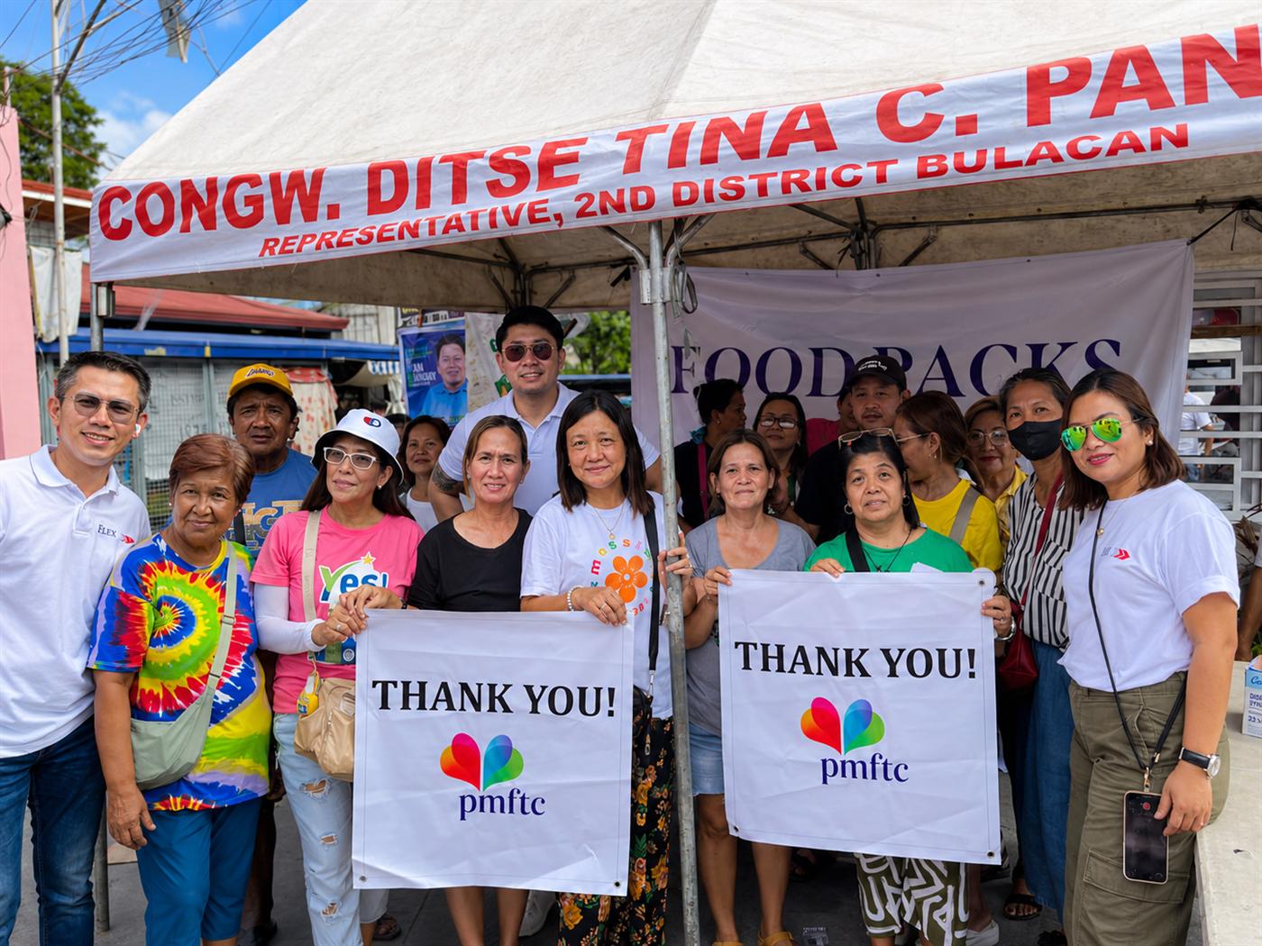 Community leaders and the Flex team together at a distribution event