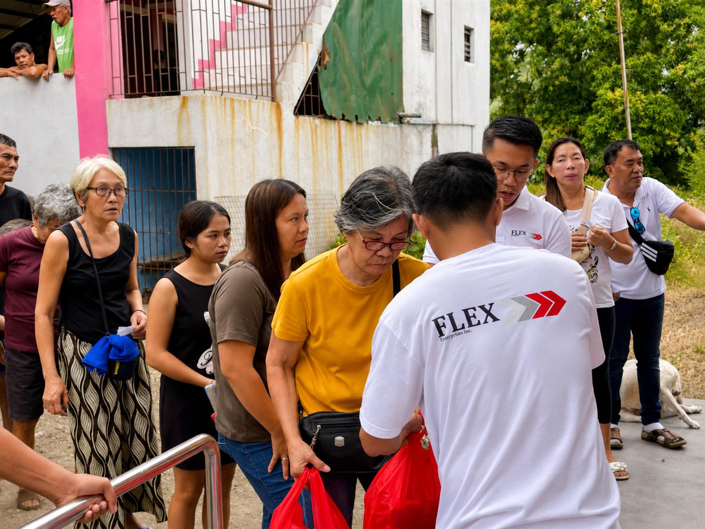 Flex team members distributing food packs directly to residents