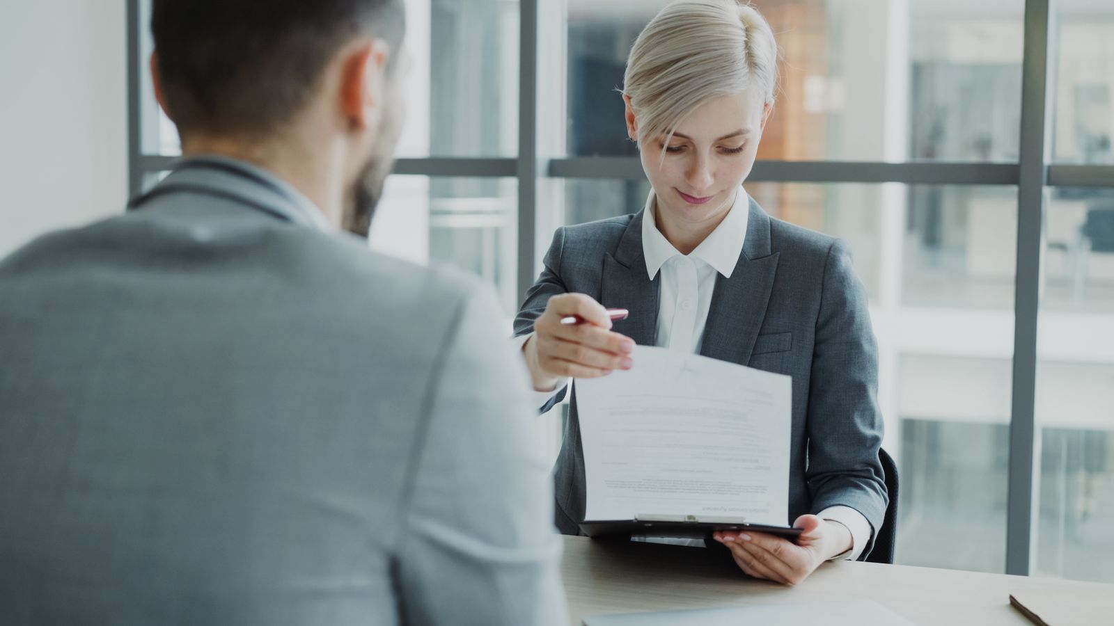 Two business representatives shaking hands after a negotiation