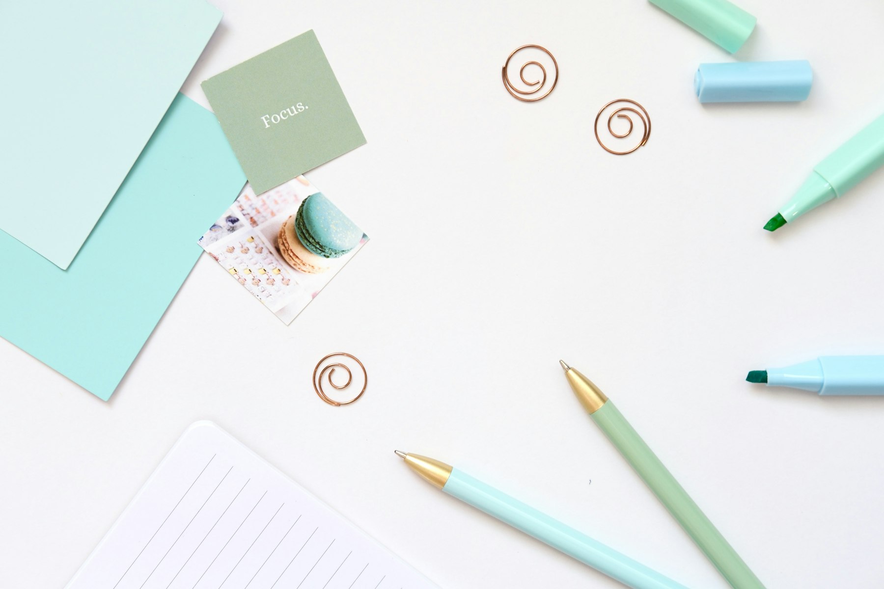 Stationery and office supplies — pens, notebooks, and paper — representing office and school supplies